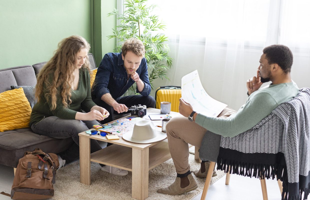 full-shot-people-planning-trip-with-map
